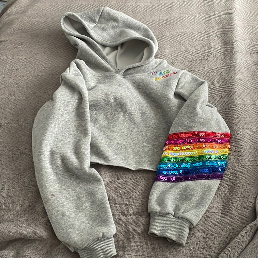 Lola + the Boys cropped hoodie with sequins details and stitching.